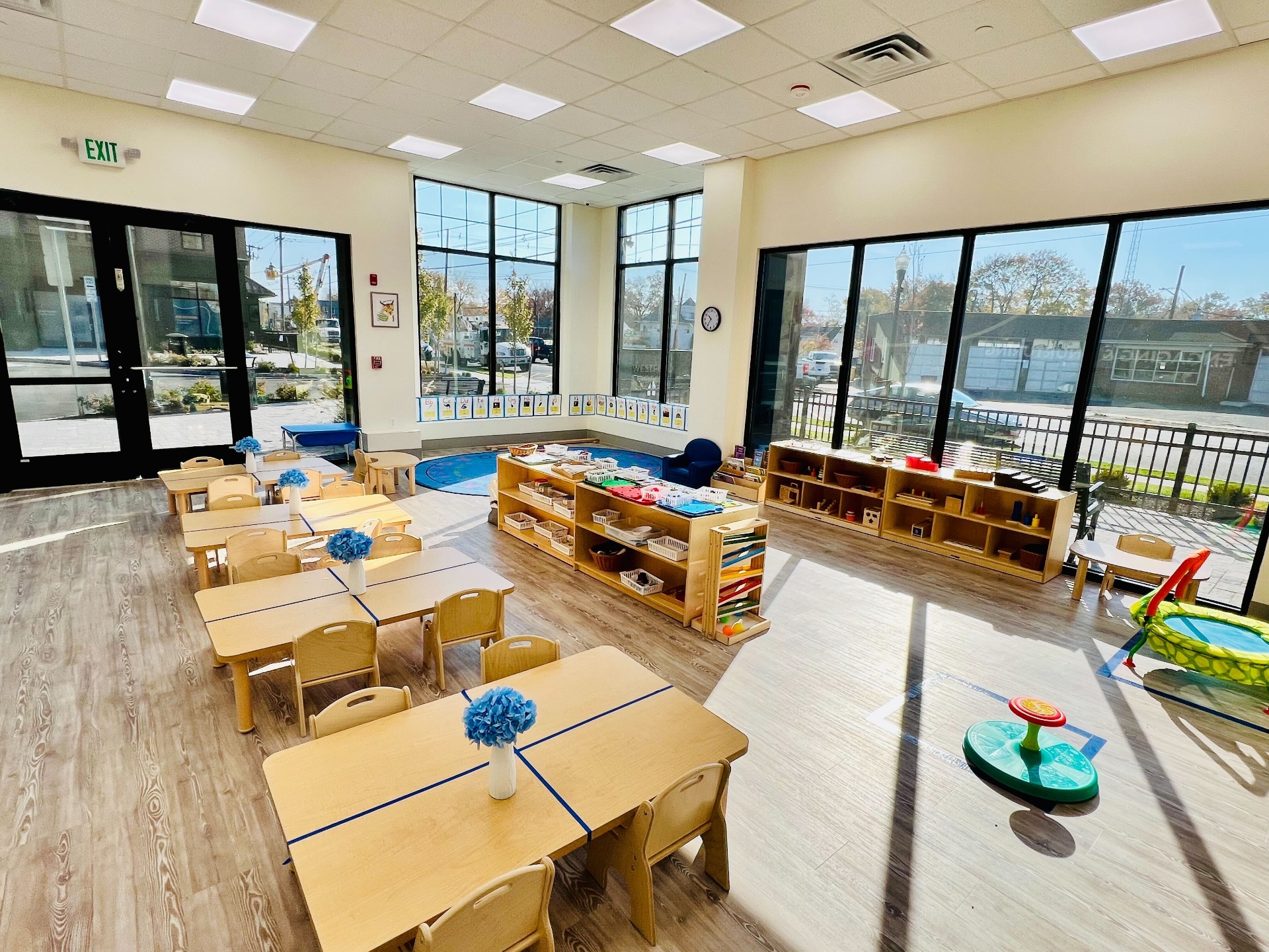 Children working with Montessori materials in a bright classroom